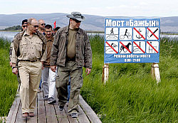 Putin and Prince Albert walking to their Lake Tere-Khol campsite Monday. Photo courtesy AP