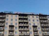"Планы партии выполним", "В единстве - наша сила": в Кызыле ремонтируют неоновые вывески на многоэтажках